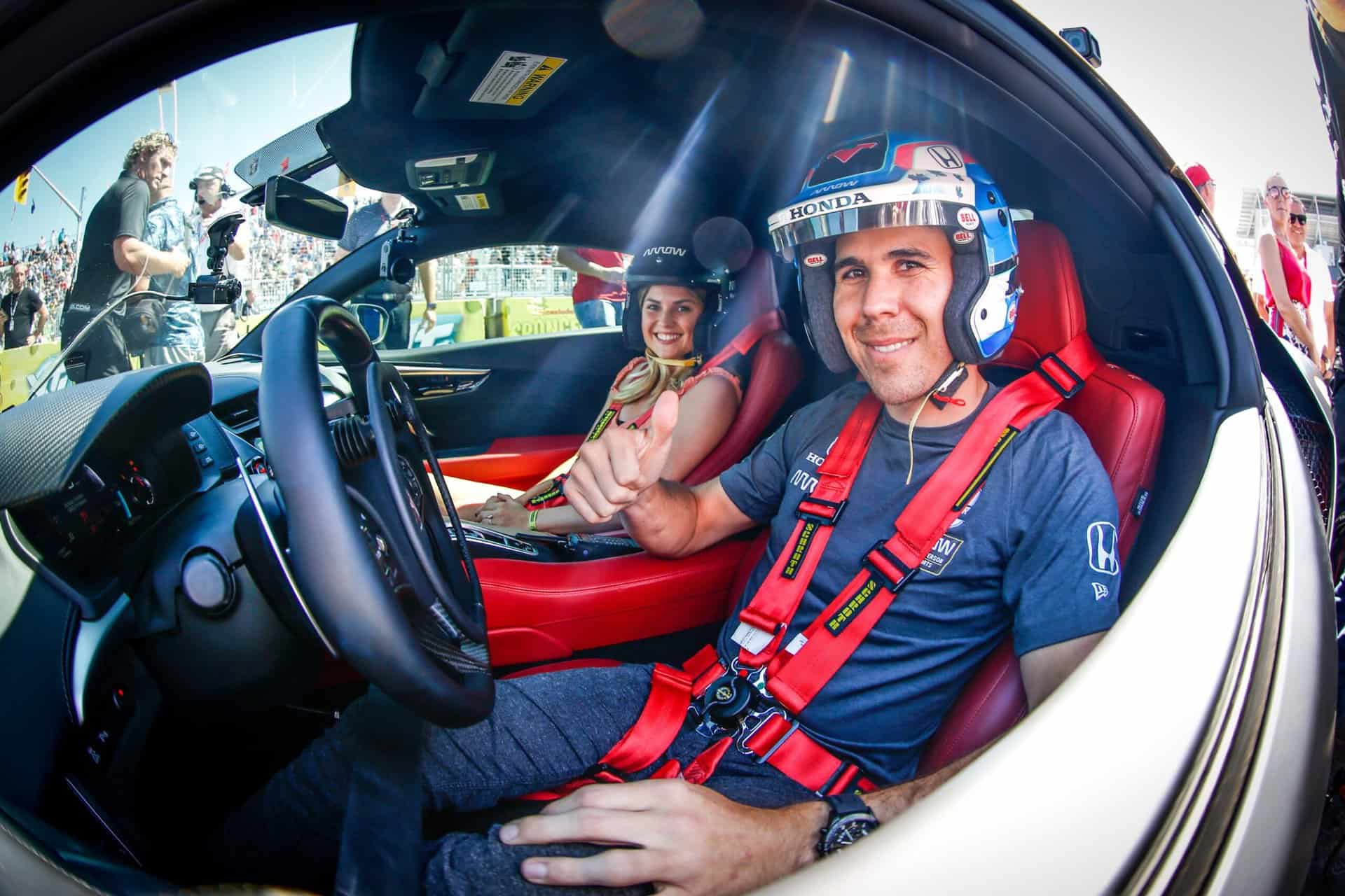 Robert Wickens hops in a modified Acura NSX with his fiance in 2019. Wickens earned the 2022 Third Quarter NMPA Pocono Spirit Award. Photo by Penske Entertainment: Shawn Gritzmacher.